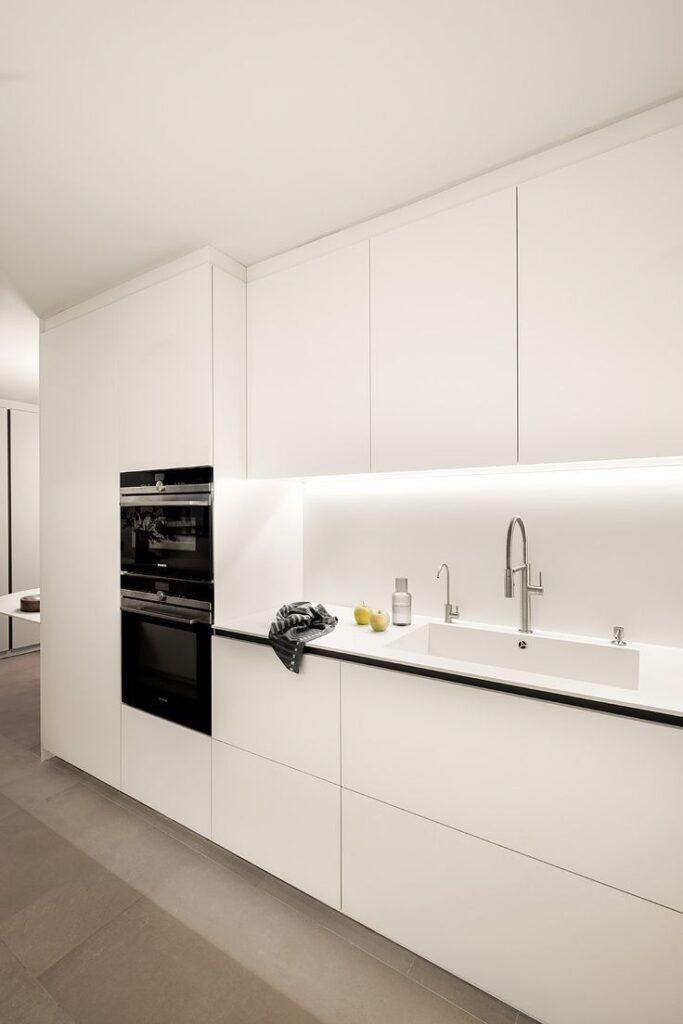 white cabinets with handle-less drawers for a sleek